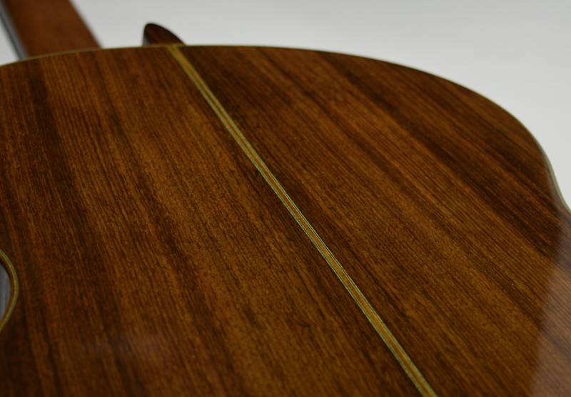 The back's finish has been restored with a French polish of shellac. 