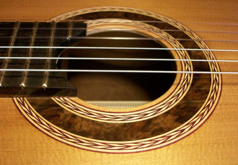 Guitar Rosette no. 20 A walnut burl surrounded by the traditional wheat border