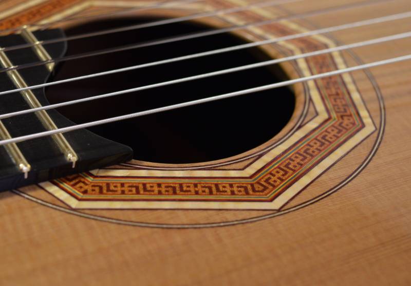 The first iteration of my octagonal rosette was inlaid by hand with a razor blade a chisel. 